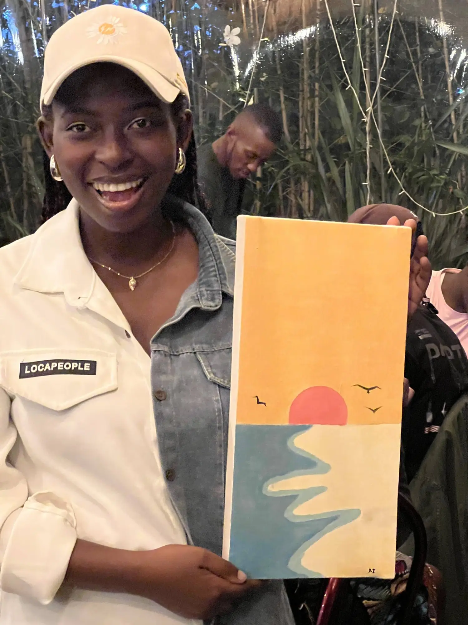 The finished piece: a sunset over the water. Signed, obviously.