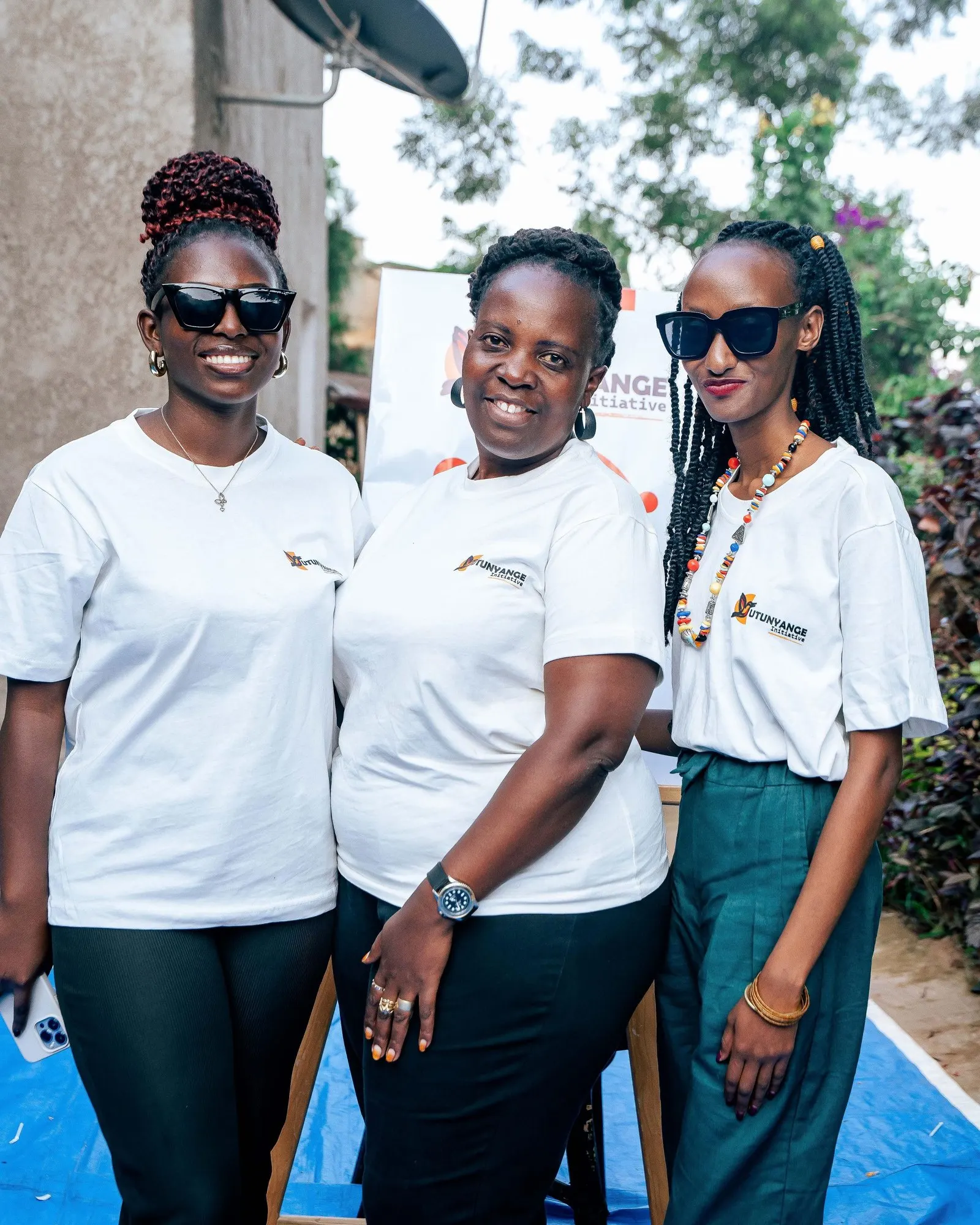 Doria with two Utunyange Health Initiative colleagues